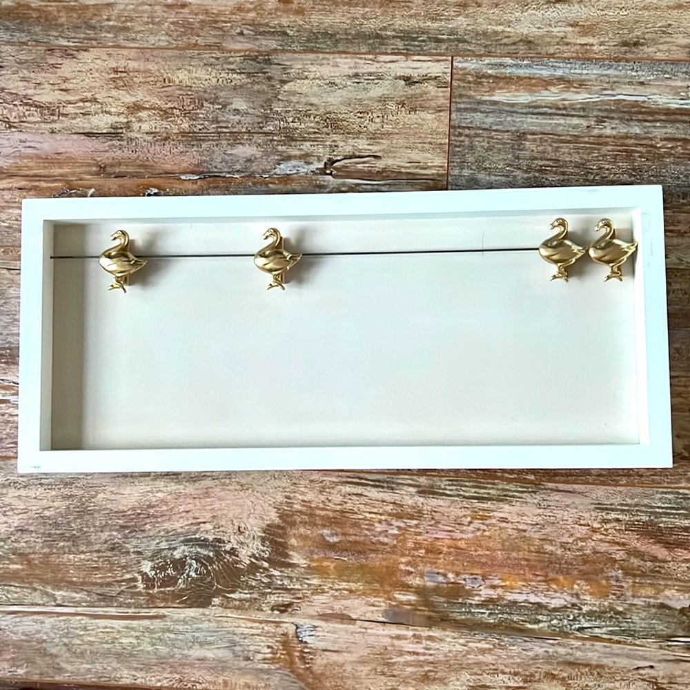 18” x 7” white wall hanger with flamingo clips